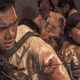 Illustration for article titled Couple fights zombies together in their Walking Dead wedding album